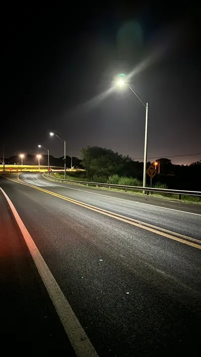 A highway at night lit by self-powered luminaires.