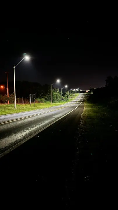 Luminaires lighting the road shoulder.