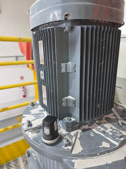 Spectra sensor at the base of a vertical motor, next to the safety rail.