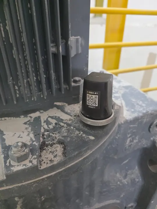 Close-up of a Spectra sensor on a motor housing.