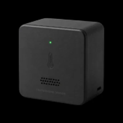 Sensor Termocube, a small black cube with a green status LED.